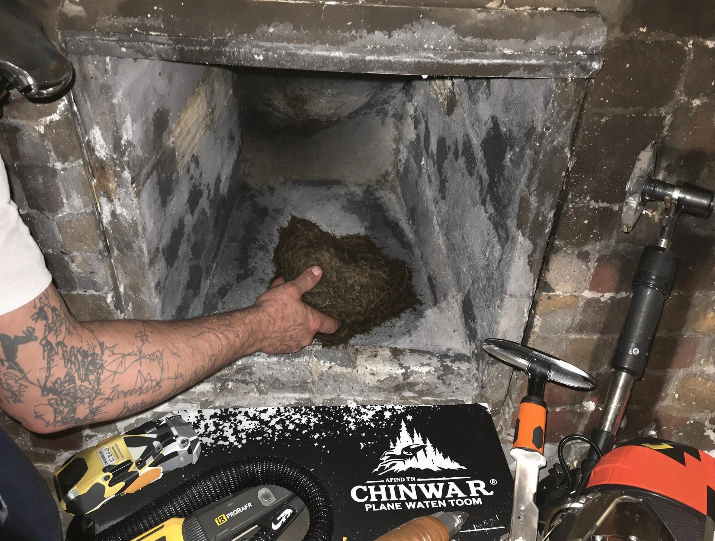 Pawtucket Chimney Sweep safely removing debris and screening chimney in Pawtucket, RI
