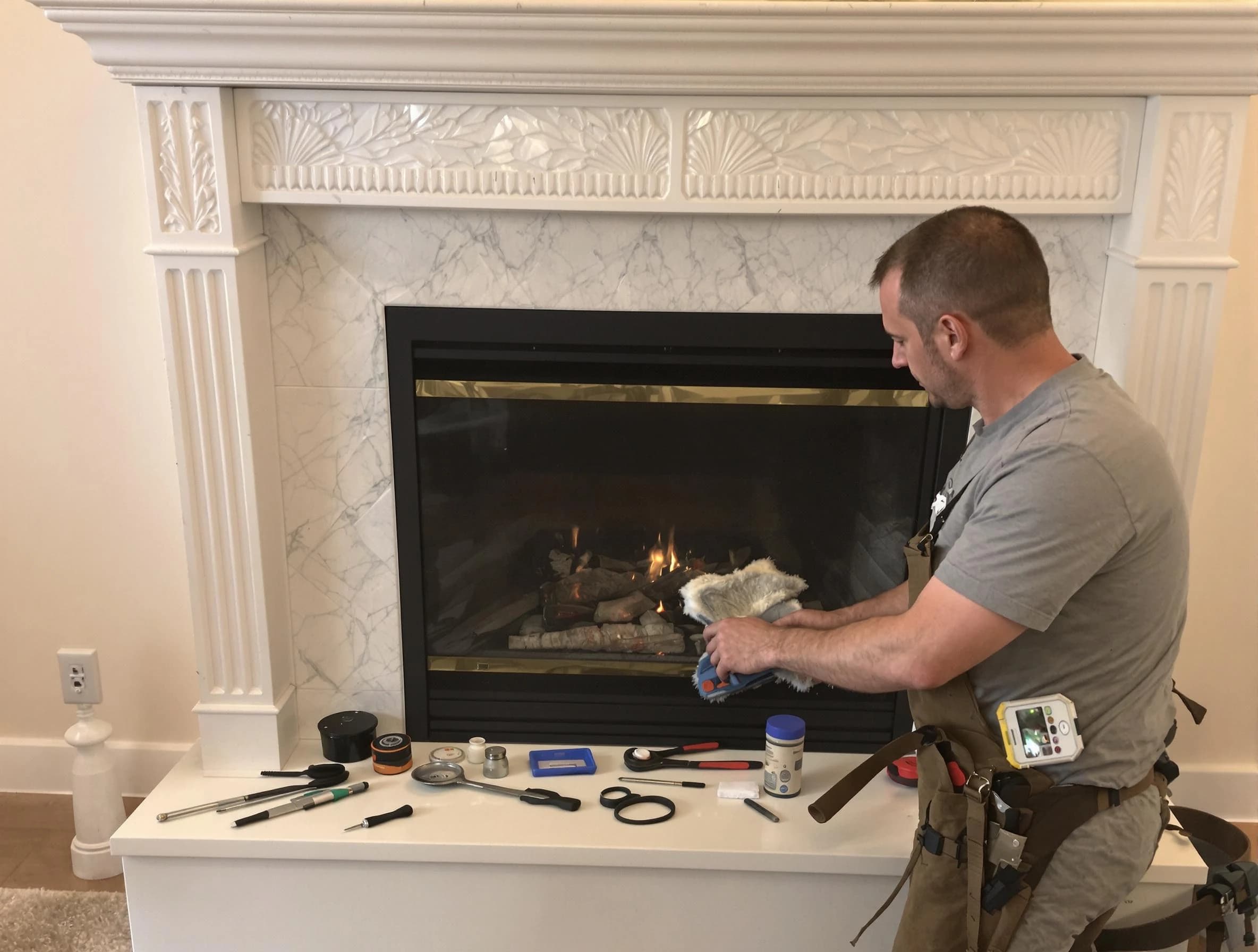 Pawtucket Chimney Sweep performing fireplace maintenance in Pawtucket, RI